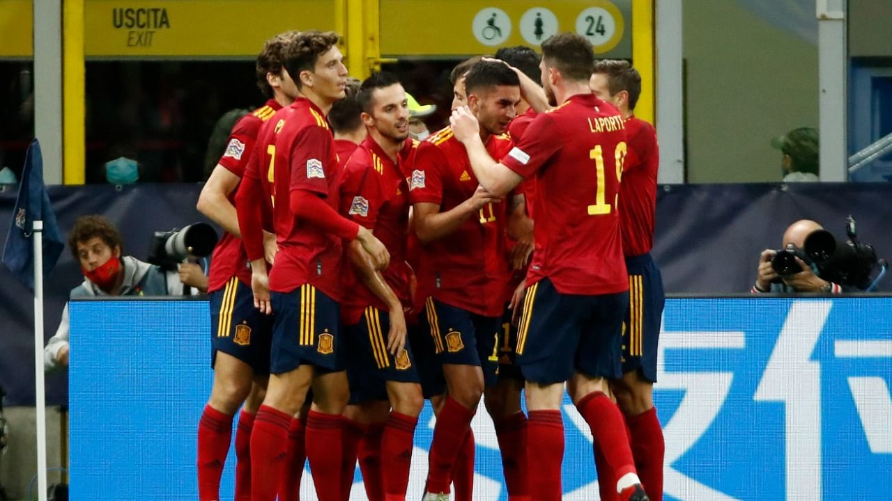 Spain players celebrate Ferran Torres' winner against Italy during their 2-1 win in Milan. Credit: Reuters Photo