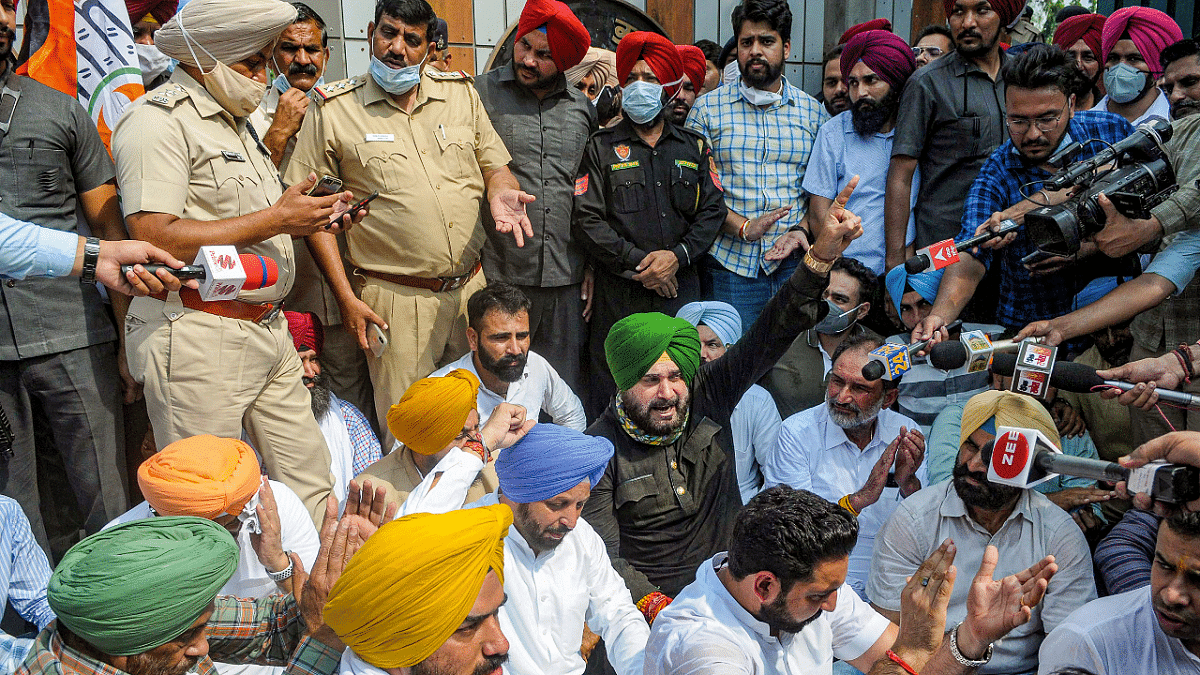 Navjot Singh Sidhu along with INC MLAs protesting in support of farmers after violenece broke out in Lakhimpur Kheri. Credit: PTI Photo