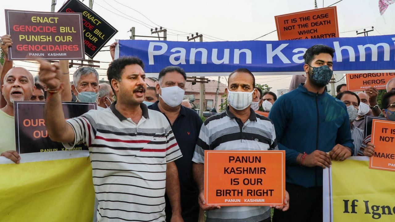 Members of Panun Kashmir shout slogans during a protest after militants shot dead two teachers in Srinagar's Eidgah Sangam area, in Jammu. Credit: PTI Photo