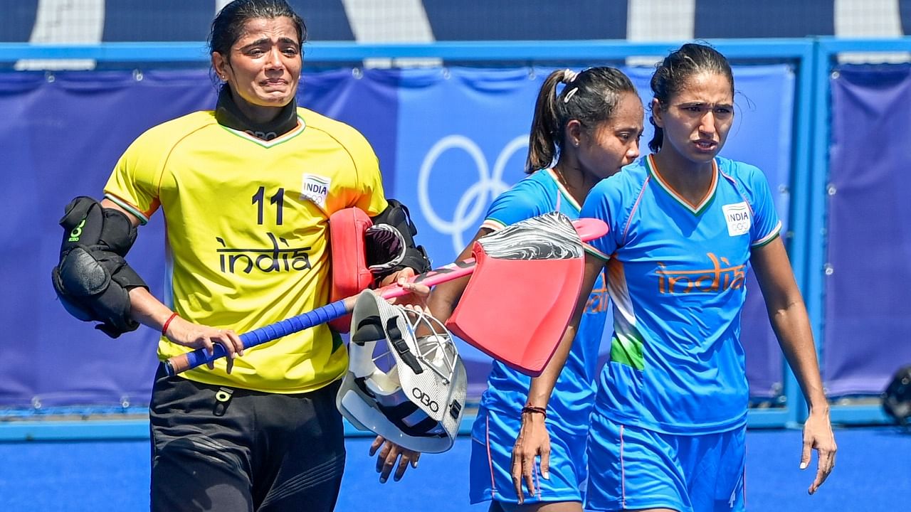 India's Savita Punia, Chanu and Monika react after losing their women's field hockey bronze medal match against Great Britain, at the 2020 Summer Olympics, in Tokyo. Credit: PTI File Photo