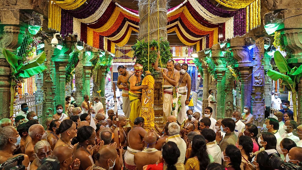 Devotees during the 'Dwajarohanam' ceremony to begin the nine-day annual Brahmotsavam festival, at a temple at Tirumala, in Tirupati, Thursday, October 7, 2021. Credit: PTI Photo