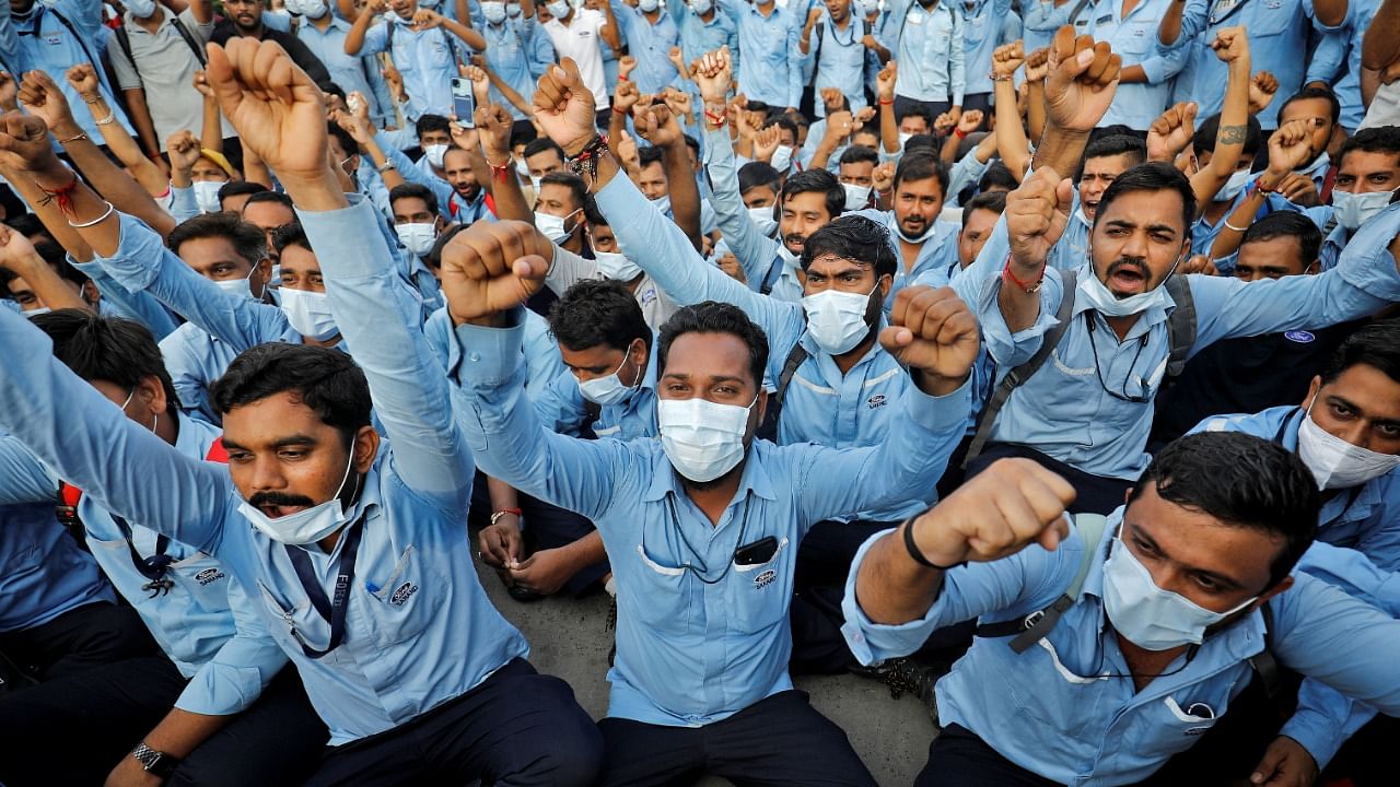 Workers of Ford Motor Co. shout slogans during a protest outside Ford's car assembly and engine-making facility in Sanand, Gujarat. Credit: Reuters Photo
