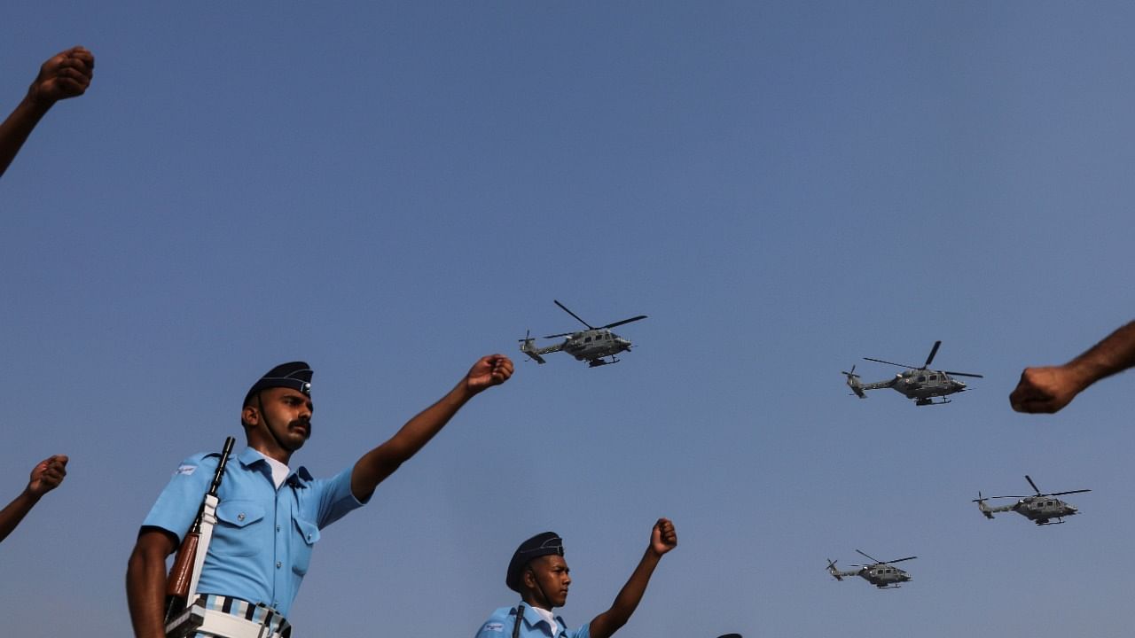 Indian Air Force (IAF) soldiers march as advanced light helicopters fly during the full dress rehearsal ahead of the 89th Air Force Day parade, at Hindon Air Force Station. Credit: Reuters Photo