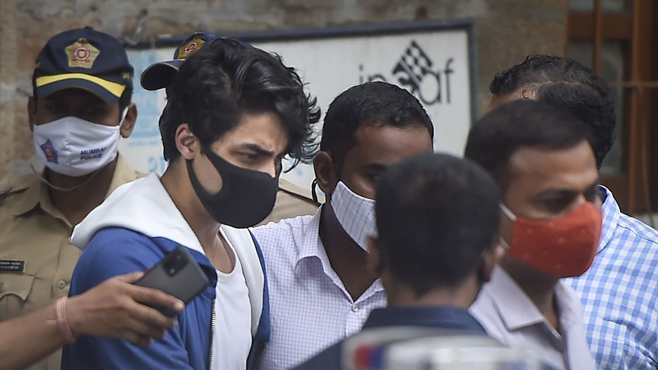 Bollywood actor Shahrukh Khan's son Aryan Khan being taken to Arthur Road jail from Narcotics Control Bureau (NCB) office after being arrested in connection with the alleged seizure of banned drugs from a cruise ship. Credit: PTI Photo