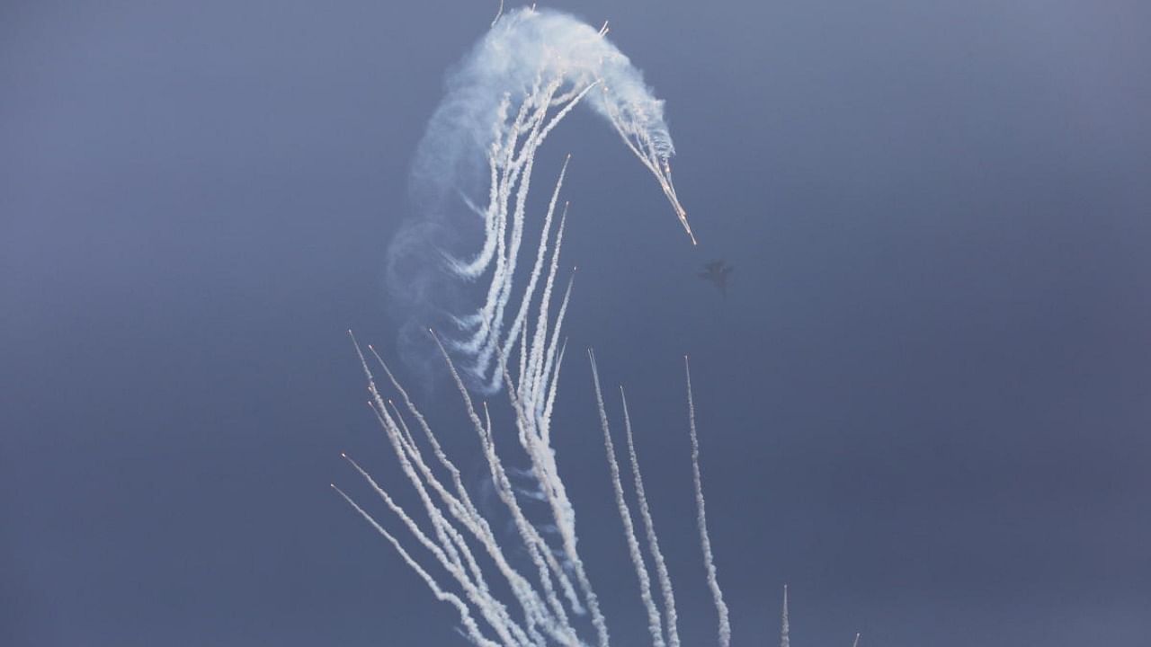 Indian Air Force's fighter jet deploys flares in the air during the 89th Air Force Day parade, at Hindon Air Force Station in Ghaziabad. Credit: Reuters photo