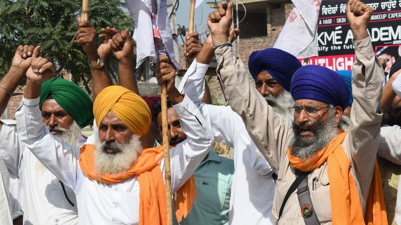 Farmers shout slogans against India's Prime Minister Narendra Modi and Uttar Pradesh state Chief Minister Yogi Adityanath during a protest on the outskirts of Amritsar on October 6, 2021. Credit: AFP File Photo