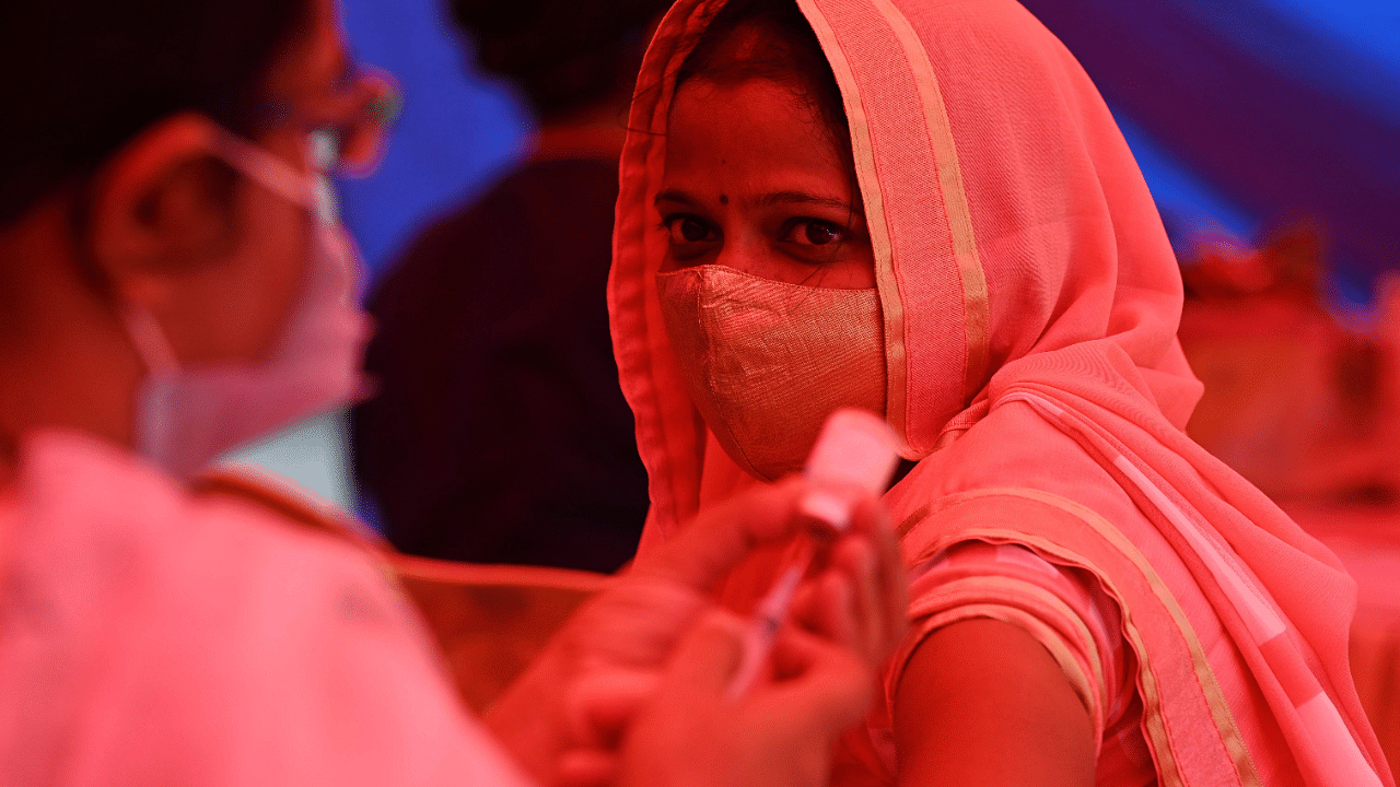 A health worker prepares a dose of the Covaxin vaccine against the Covid-19 at a vaccination centre in New Delhi. Credit: AFP Photo