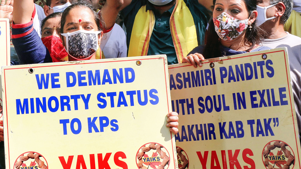 Members of the Youth All India Kashmir Samaj (YAIKS) stage a protest against the killing of Kashmiri Pandit businessman Makhan Lal Bindroo and two others by militants in Srinagar. Credit: PTI Photo