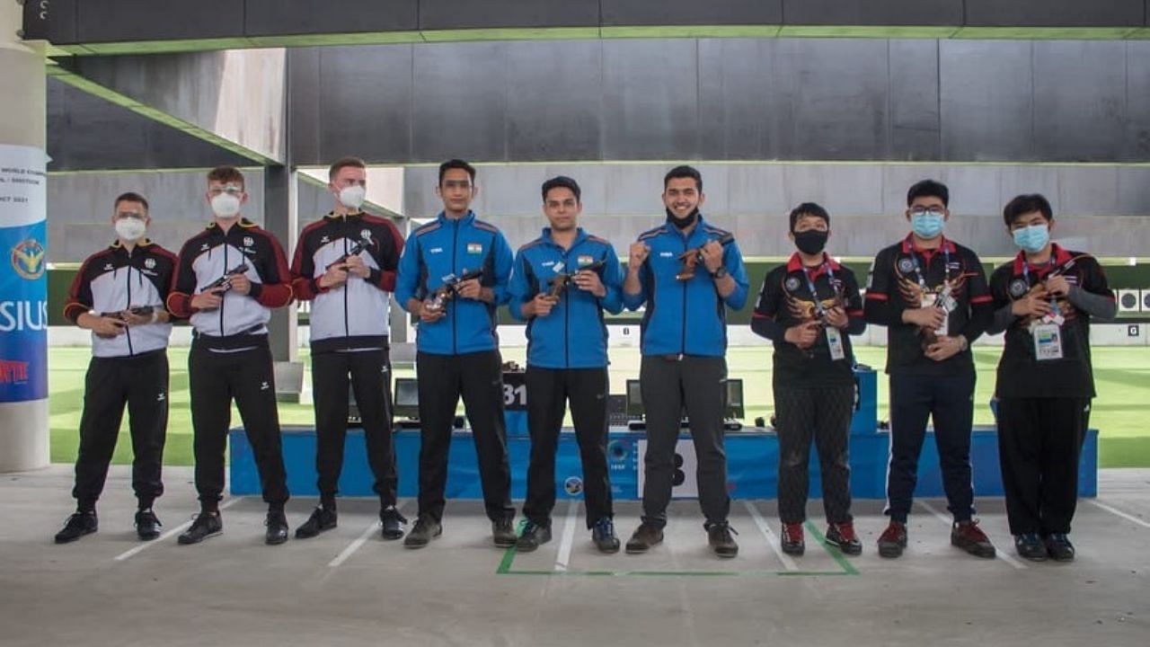 Indian shooters Anish Bhanwala, Adarsh Singh and Vijayveer Sidhu along with other winners. Credit: Twitter/ @Media_SAI