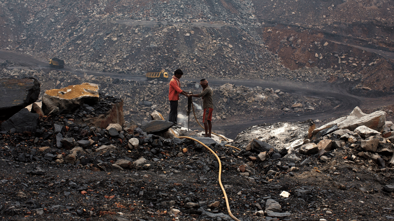 Workers drill at an open cast coal field at Dhanbad district in Jharkhand. Credit: Reuters Photo