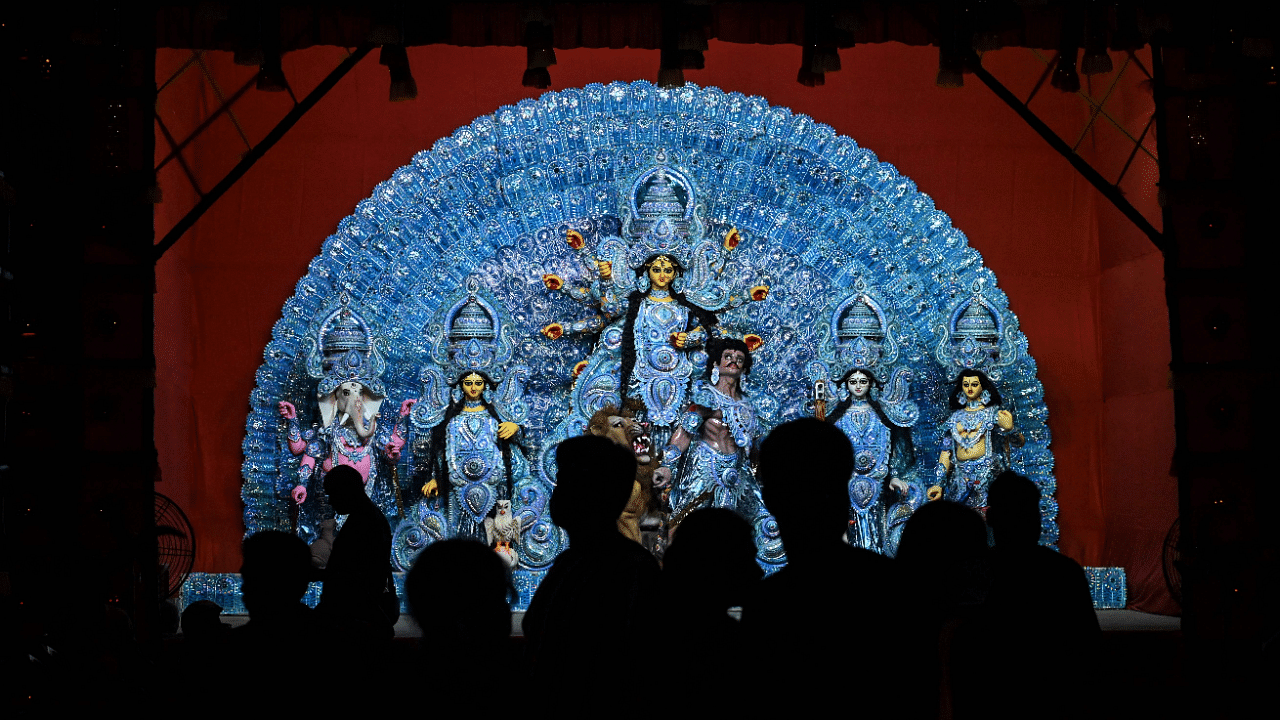 People visit a makeshift place of worship on the occasion of Durga Puja festival in Kolkata. Credit: AFP Photo