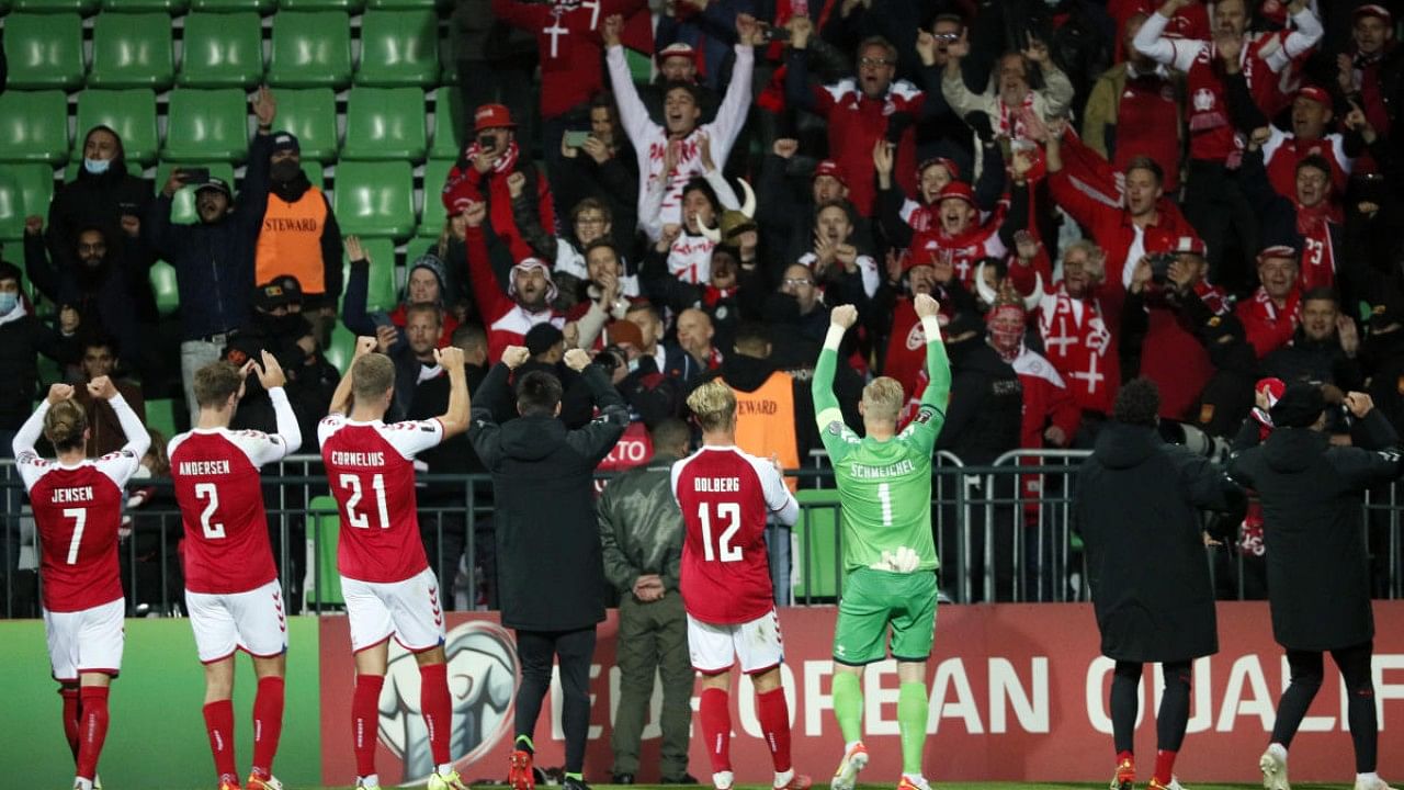 Denmark players celebrate in front of fans after the match. Credit: Reuters Photo