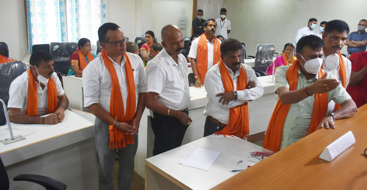 BJP members oppose the move by the Returning Officer.