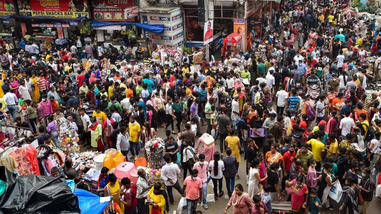Crowded New Market area ahead of the Durga Puja festival in Kolkata, Sunday, Oct 10, 2021. Credit: PTI Photo