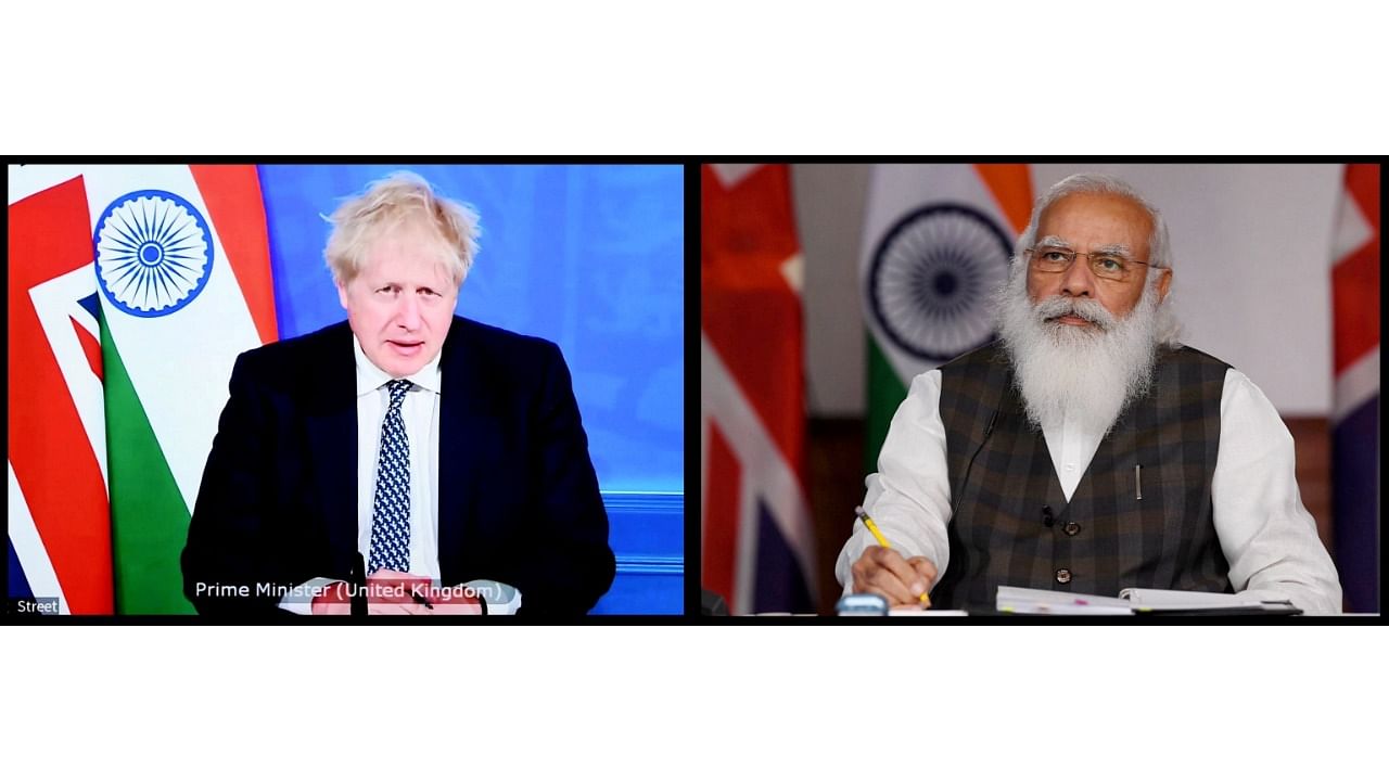 Prime Minister Narendra Modi and his UK counterpart Boris Johnson. Credit: PTI File Photo