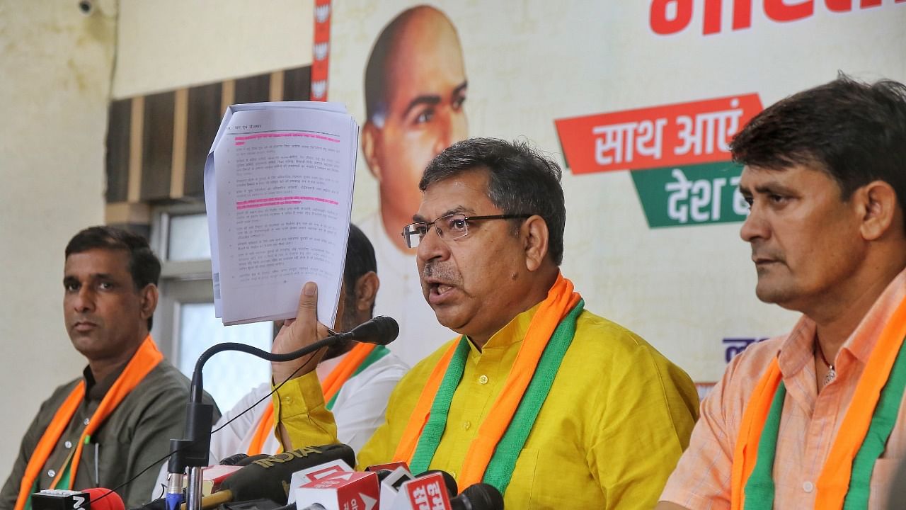 Rajasthan BJP President Satish Poonia addresses a press conference over the REET exam rigging, in Jaipur, Thursday, September 30. Credit: PTI File Photo