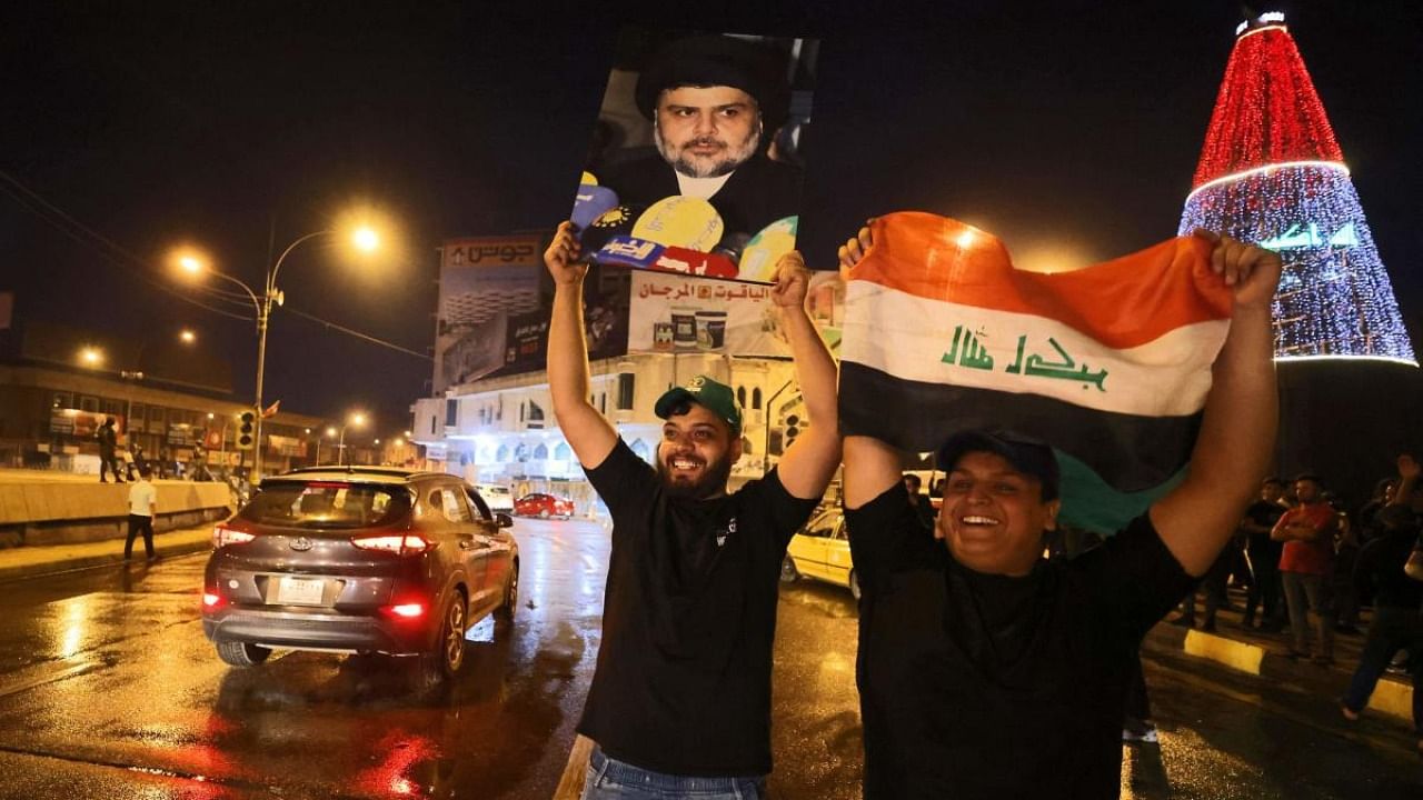 Supporters of Iraqi Shiite cleric Moqtada al-Sadr celebrate in Baghdad's Tahrir square. Credit: AFP Photo