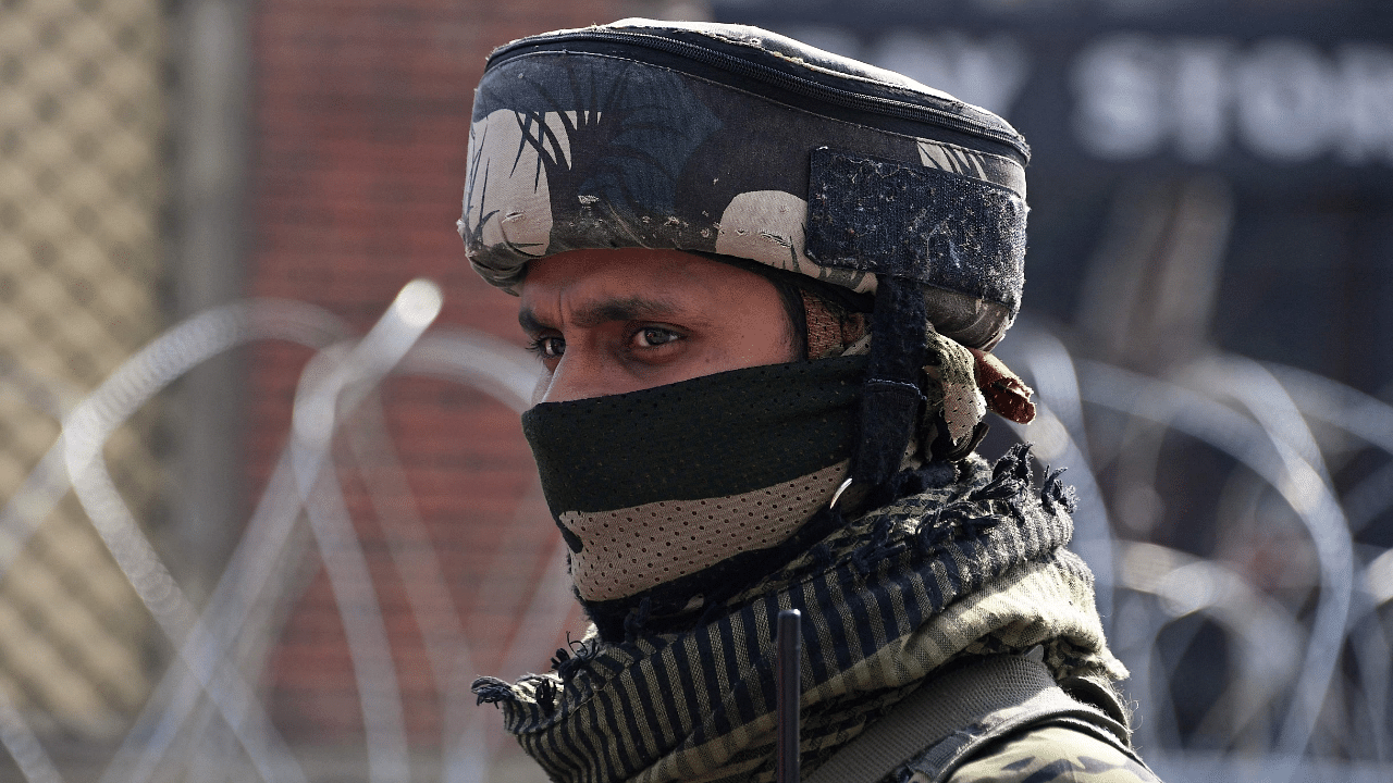 An Indian paramilitary trooper stands guard in Srinagar. Credit: AFP Photo
