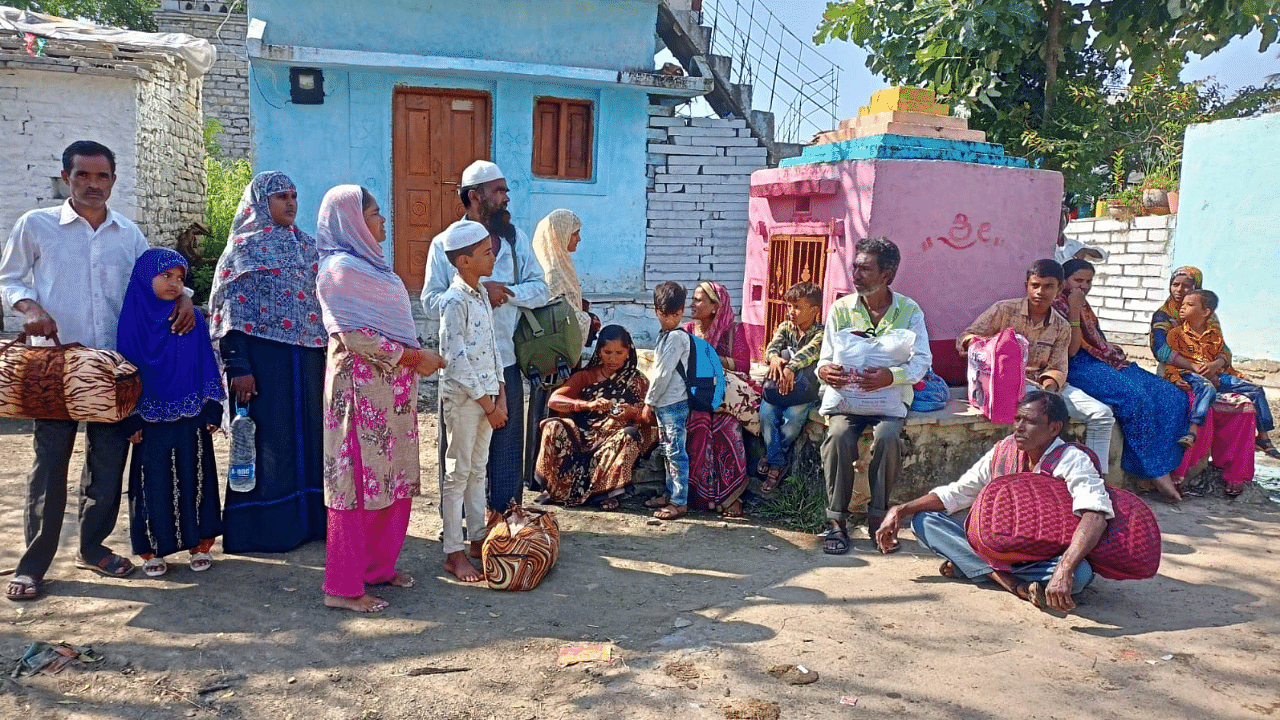Residents of Gadikeshwar village wait for a vehicle to leave the village. Photo Credit: Jagannath Sherikar