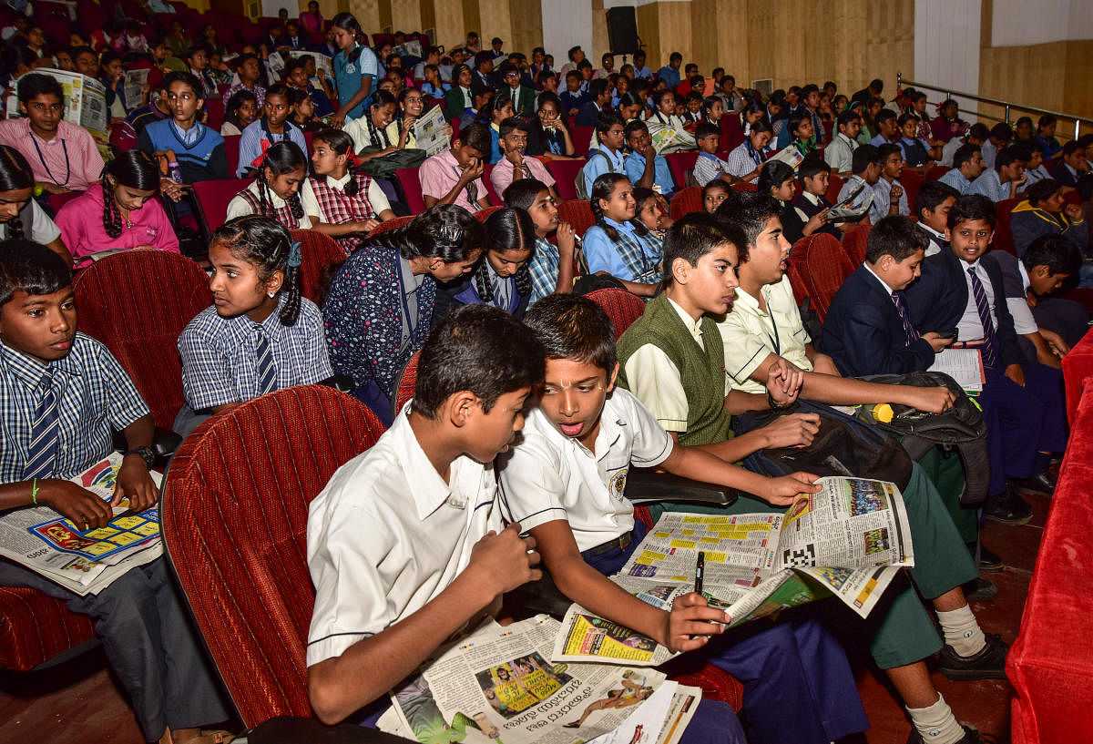 Students reading Prajavani news paper during Prajavani Quiz Championship, at Senate Bhavan in Mysuru on Monday January 08, 2018.- PHOTO / IRSHAD MAHAMMAD