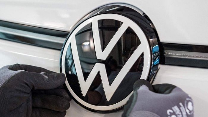  VW logo is seen at the assembly line for the Volkswagen ID 3 electric car. Credit: AFP File Photo