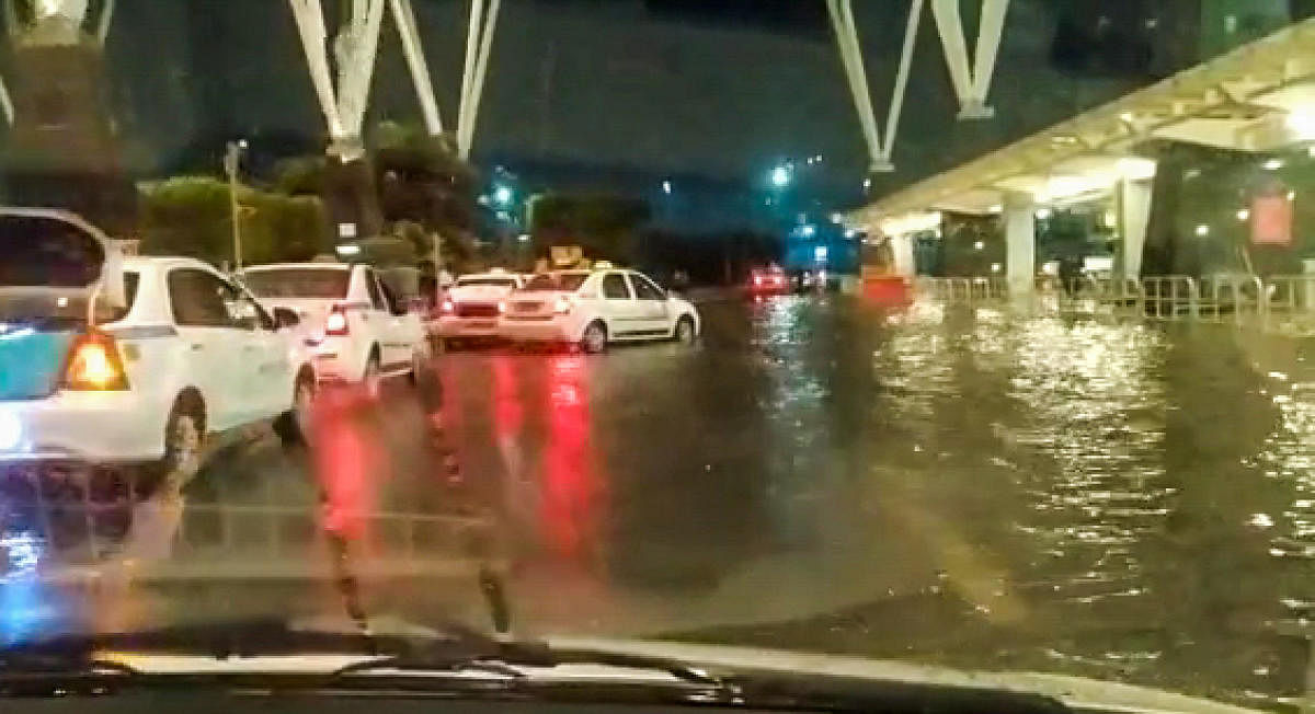 KIA;s concourse inundated after hours of rains. Credit: Special Arrangement