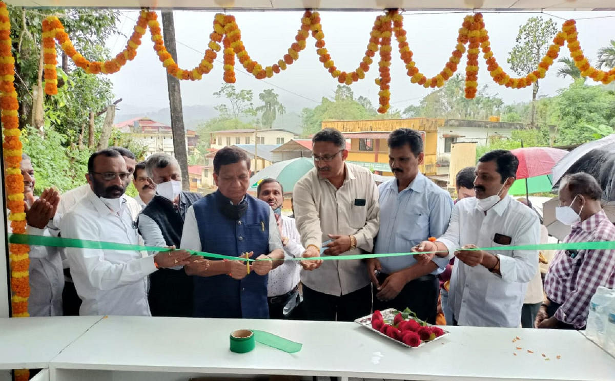 Virajpet MLA K G Bopaiah inaugurates a milk parlour by Hamul in Bhagamandala on Wednesday.