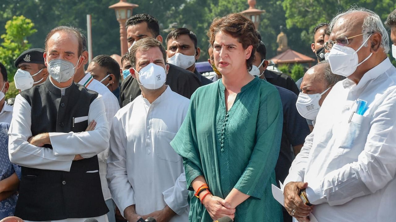 Congress delegation members MP Rahul Gandhi (2L), party General Secretary Priyanka Gandhi (2R), leader of opposition in Rajya Sabha Mallikarjun Kharge (R) and senior leader Ghulam Nabi Azad (L) address media after a meeting with President Ram Nath Kovind on the Lakhimpur Kheri incident. Credit: PTI Photo