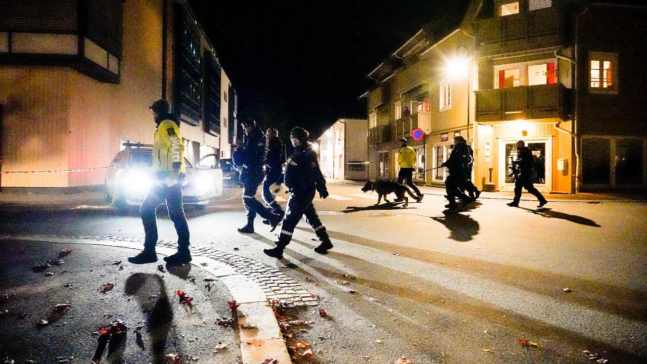 Police officers cordon off the scene where they are investigating in Kongsberg, Norway after a man armed with bow killed several people before he was arrested by police. Credit: AFP Photo