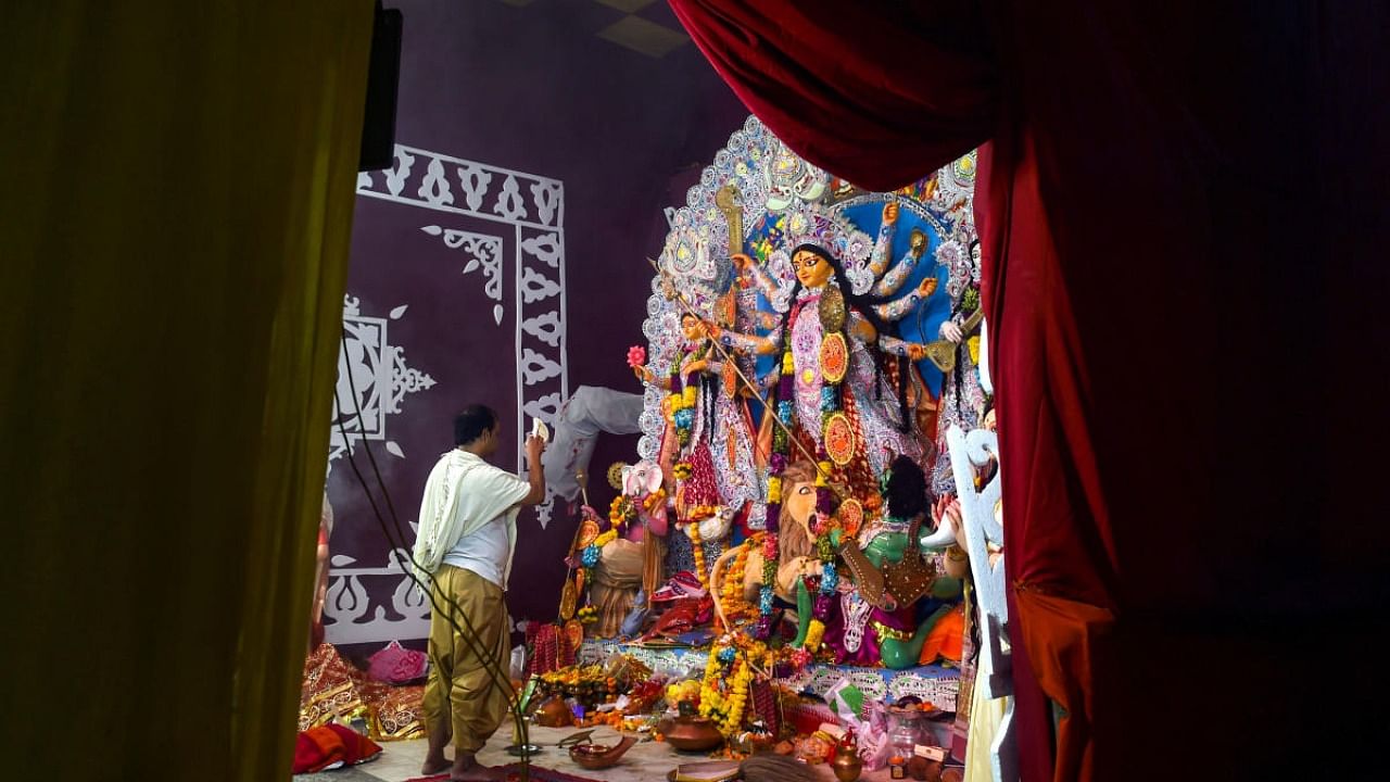 An idol of Goddess Durga at the Kali Bari pandal on the occasion of 'Maha Ashtami' at Mandir Marg, in New Delhi. Credit: PTI Photo