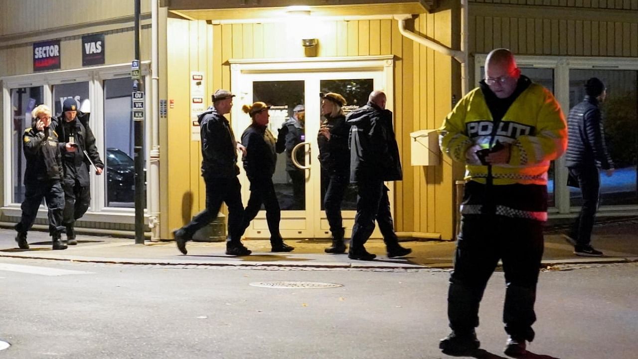 Police officers investigate at the scene where an arrow shot into a wall after several people were killed and others were injured by a man using a bow and arrows to carry out attacks, in Kongsberg. Credit: Reuters Photo