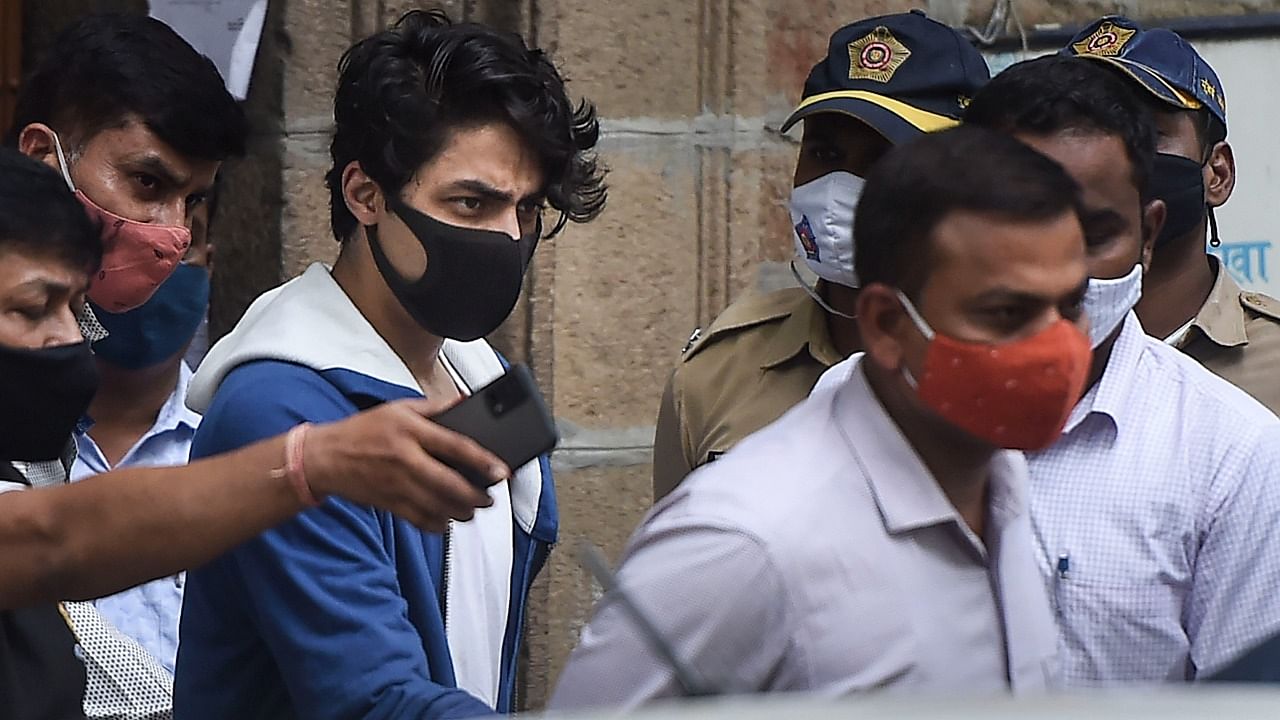 Bollywood actor Shahrukh Khan's son Aryan Khan being taken to Arthur Road jail from Narcotics Control Bureau (NCB) office after being arrested in connection with the alleged seizure of banned drugs from a cruise ship, in Mumbai. Credit: PTI Photo