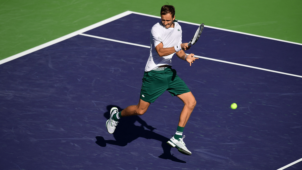 Daniil Medvedev of Russia hits a forehand return to Grigor Dimitrov of Bulgaria in their Round of 16 match at the Indian Wells tennis tournament. Credit: AFP Photo