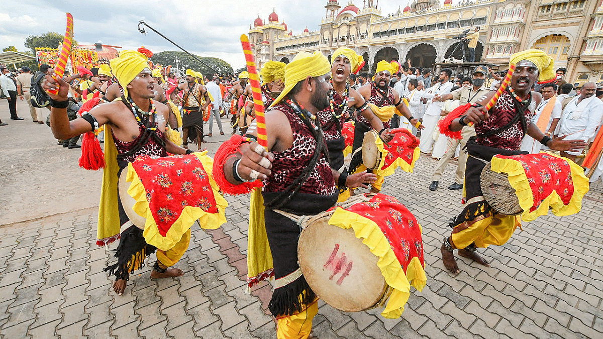 Devotees during Dasara procession at the Mysuru Palace. Credit: PTI Photo