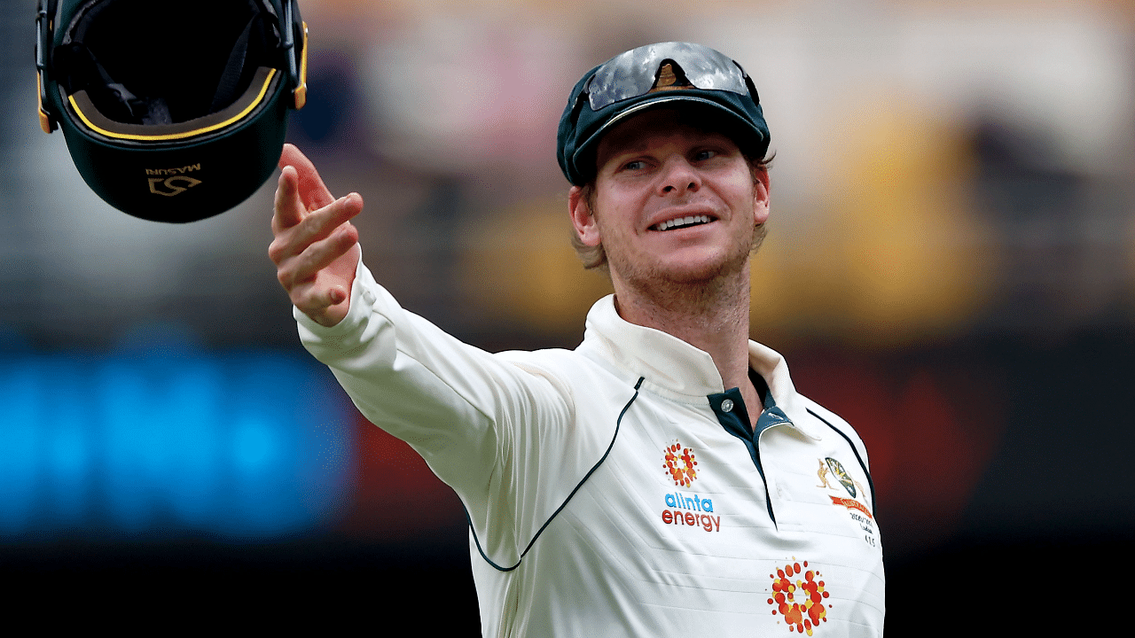 Australia's batsman Steve Smith throws the helmet towards wicketkeeper Tim paine. Credit: AFP Photo