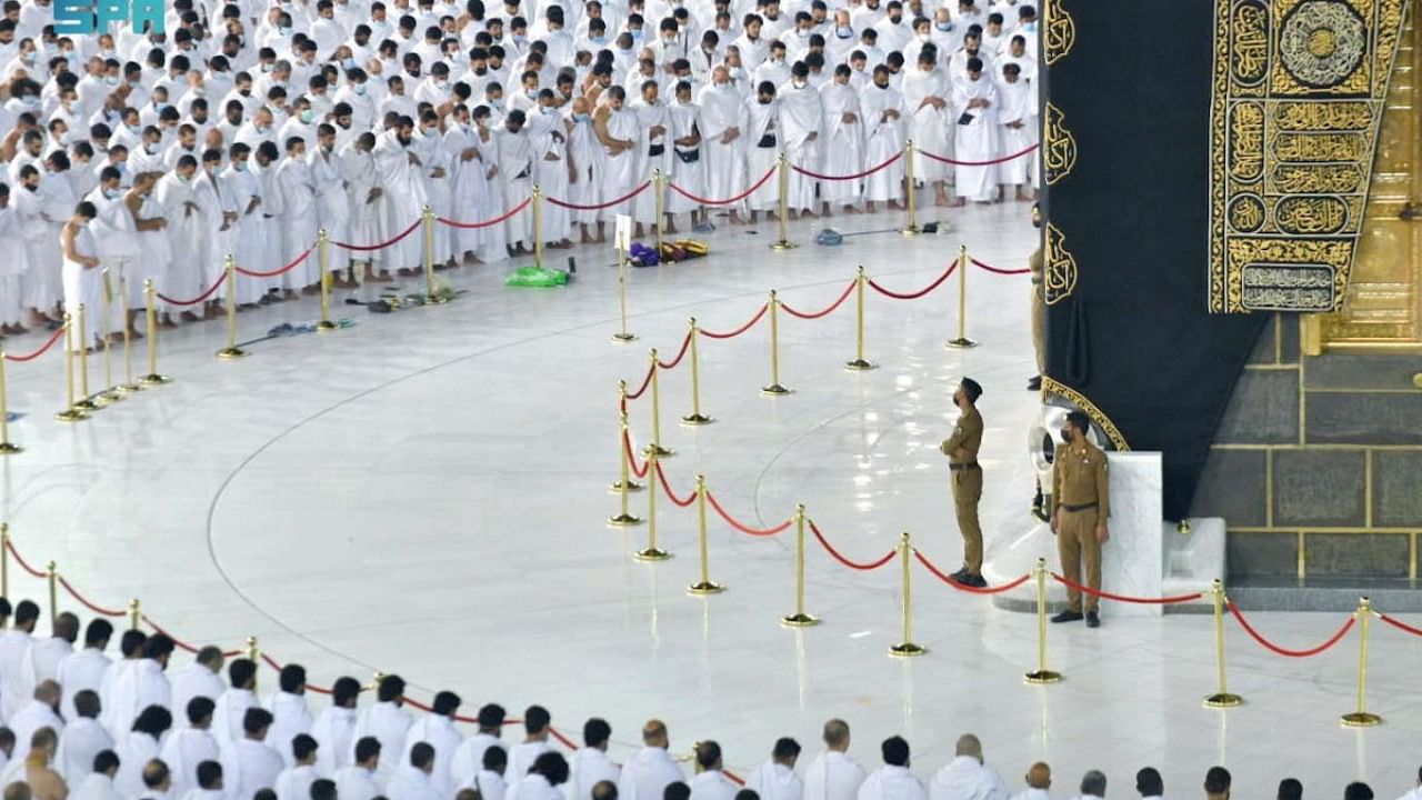 Pilgrims perform the Fajr prayer without social distancing amid easing of Covid-19 measures at the Grand Mosque in holy city of Mecca. Credit: Reuters Photo