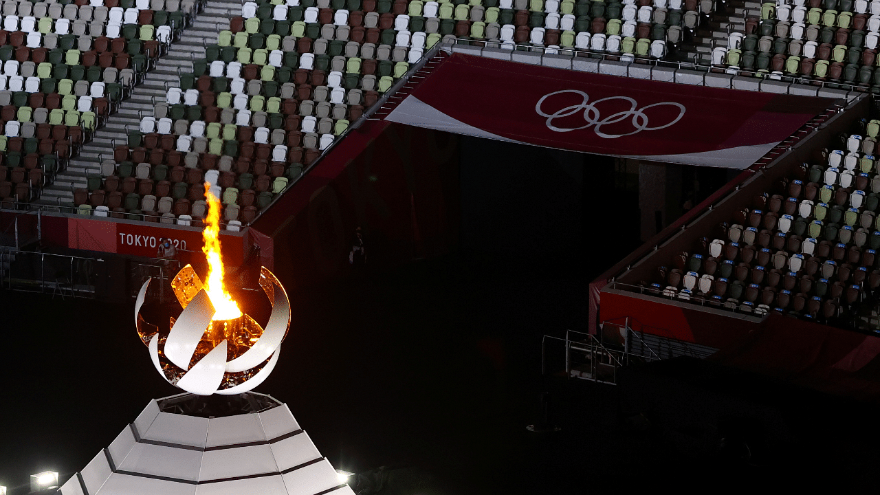  The Olympic flames is seen during the closing ceremony at Tokyo Games 2020. Credit: Reuters File Photo