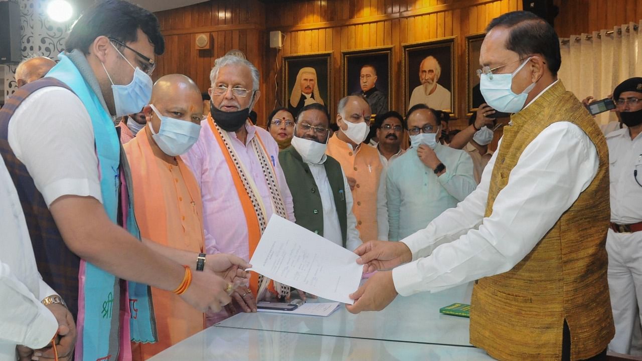 Nitin Agarwal (L) files his nomination for the post of Deputy Speaker for UP Assembly, in presence of Uttar Pradesh Chief Minister Yogi Adityanath at Vidhan Bhawan in Lucknow. Credit: PTI Photo