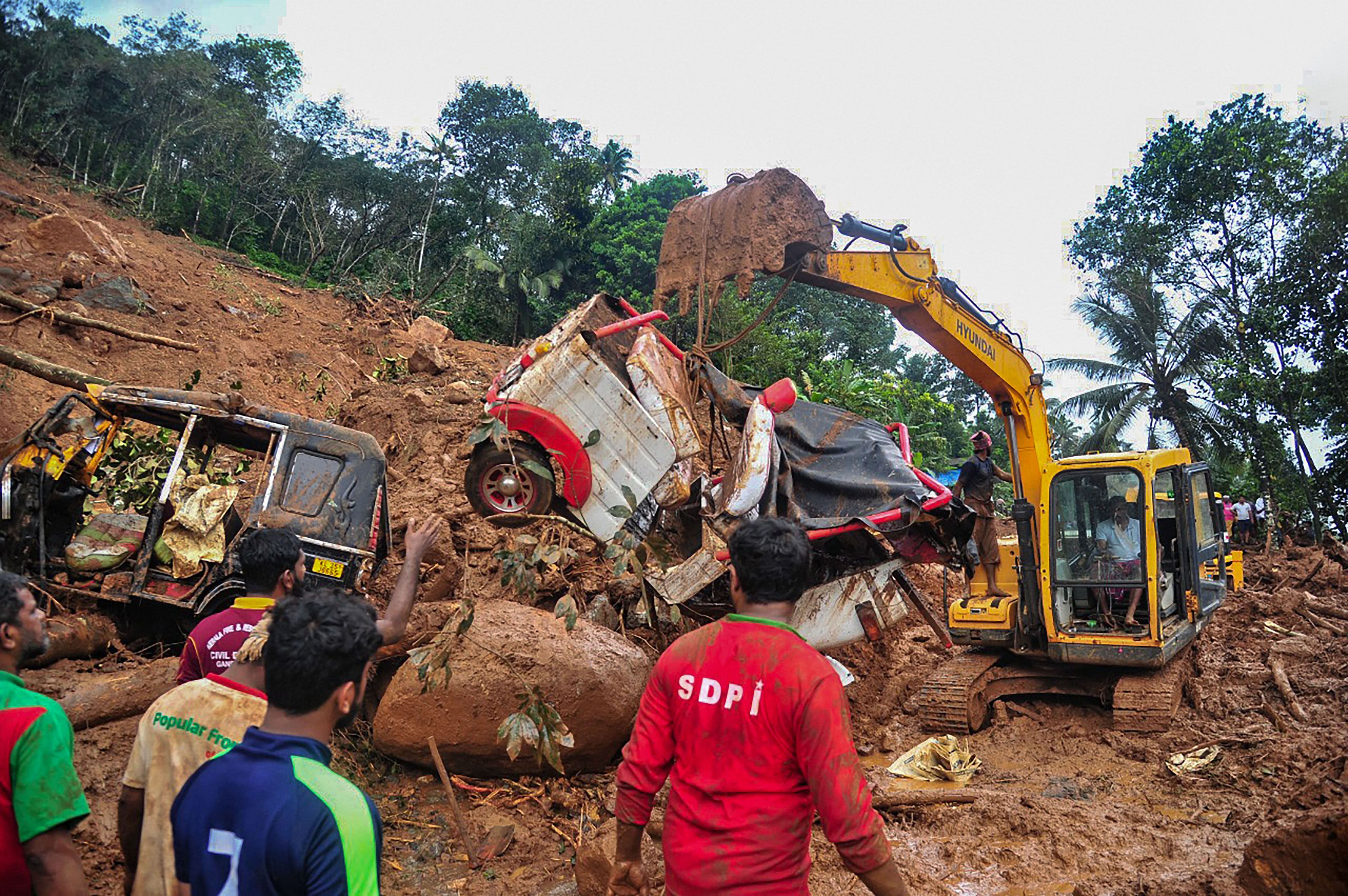Rescue workers conduct a rescue operation after a landslide due to heavy rain in Idukki. Credit: PTI Photo