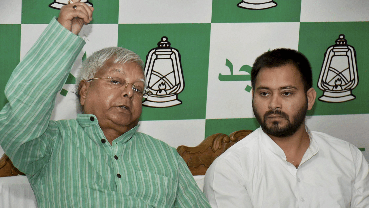 RJD Chief Lalu Prasad and Tejashwi Yadav. Credit: PTI Photo