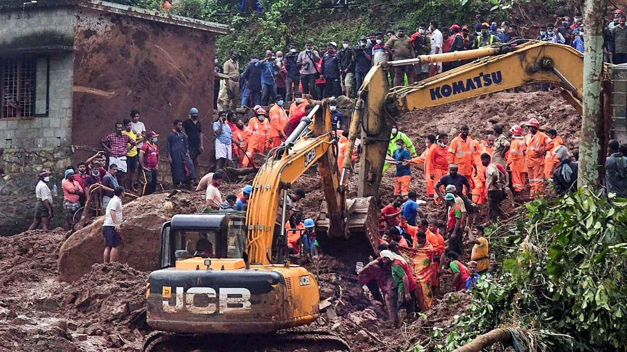 NDRF team during rescue operation after a landslide due to heavy rain, at Poovanchi hill in Kottayam District. Credit: PTI Photo
