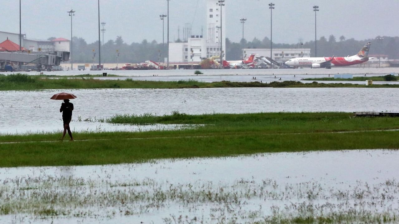 A man walks inside the flooded Cochin international airport after the opening of Idamalayar, Cheruthoni and Mullaperiyar dam shutters following heavy rain, on the outskirts of Kochi, India, August 15, 2018. Credit: Reuters File Photo