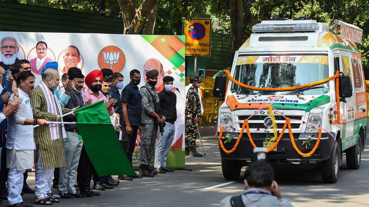 Union Home Minister Amit Shah flags off 'Modi Van' under BJP's 'Seva hi Sangathan' programme in New Delhi. Credit: PTI Photo