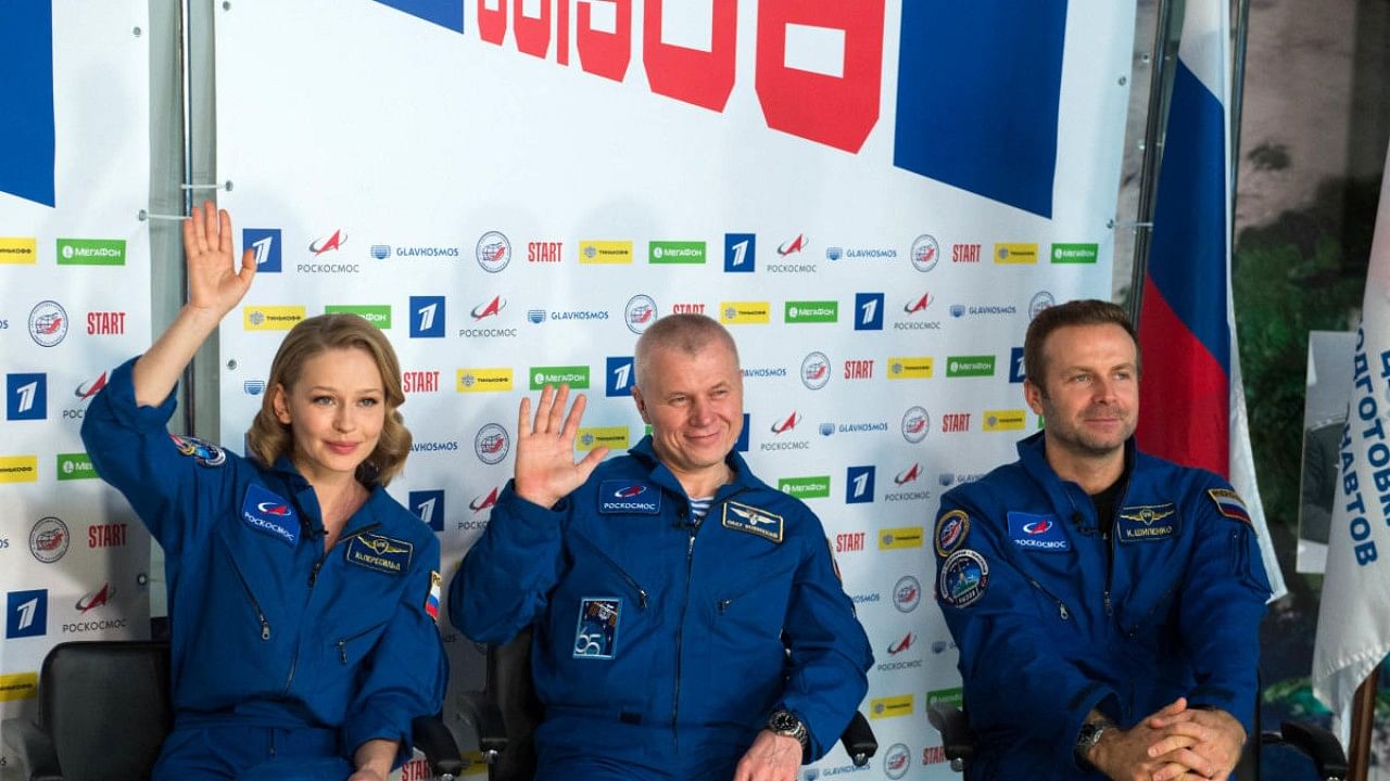 Russian cosmonaut Oleg Novitsky (C), actress Yulia Peresild and film director Klim Shipenko hold a press conference following their return from the International Space Station (ISS). Credit: AFP Photo
