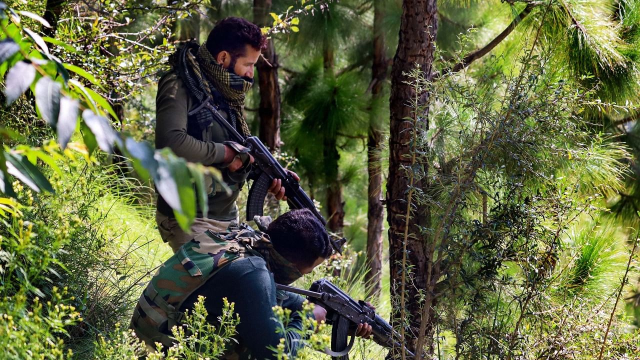 Security personnel near the site of an encounter with militants at Nar Khas area of Mendhar, in Poonch. Credit: PTI Photo