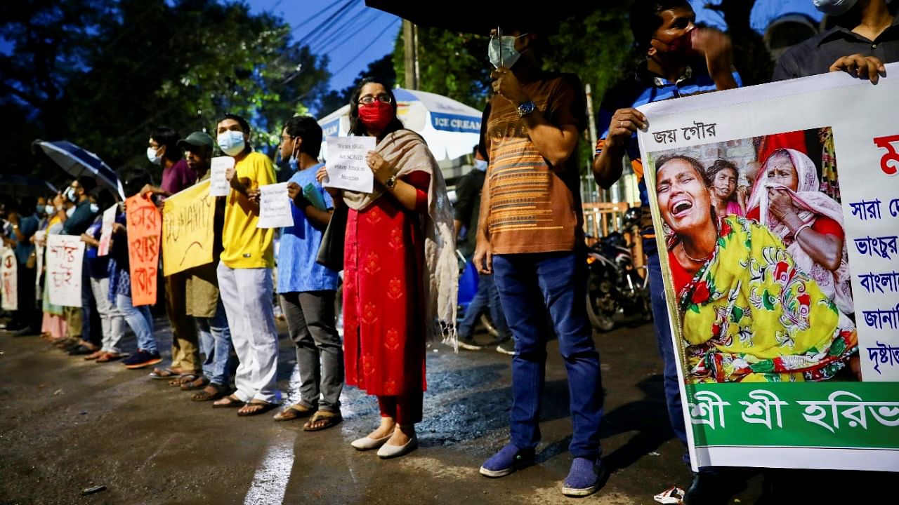 Bangladeshi writers and activists take part in a human chain demanding to stop communal violence and justice for the violence against Hindu communities during Durga Puja festival in Dhaka. Credit: Reuters File Photo