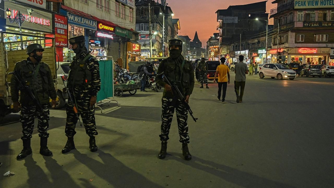 Indian paramilitary troopers stand guard along a street ahead of the visit of India's Home Minister Amit Shah, in Srinagar on October 20, 2021. Credit: AFP Photo