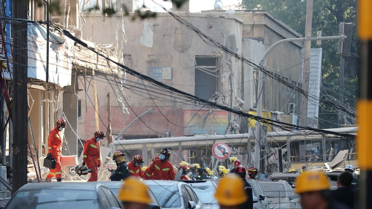Rescue workers at the site following a gas explosion at a restaurant in Shenyang. Credit: Reuters Photo