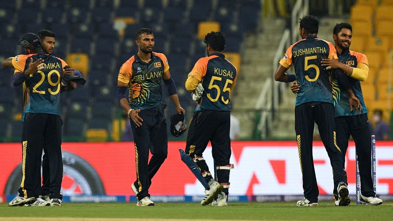 Sri Lankan players celebrate their victory over Ireland. Credit: AFP Photo