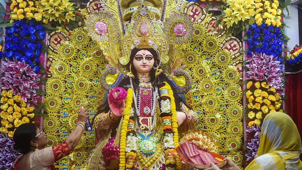 Idol of Goddess Lakshmi being worshipped at the residence of a Hindu devotee, in Kolkata. Credit: PTI Photo